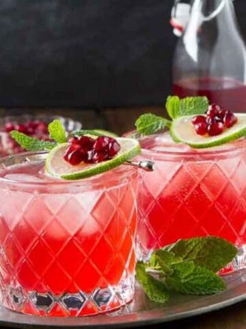 The holidays call for festive cocktails and what better way to welcome your guests then with this Pomegranate Lime Gin Fizz.