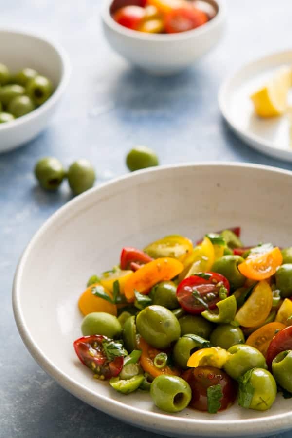 Sweet, salty and a little sour, this Green Olive, Tomato and Pomegranate Salad can double as an appetizer, main course or snack! 