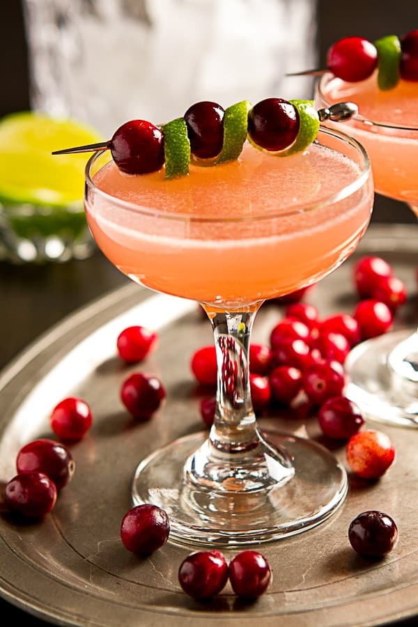 Sweet, tart and not too boozy, this easy vodka Ruby Red Cosmopolitan cocktail recipe is just right for a holiday or winter party.