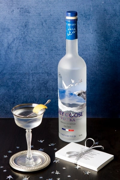 Bottle of grey goose vodka, a vodka martini and recipe cards