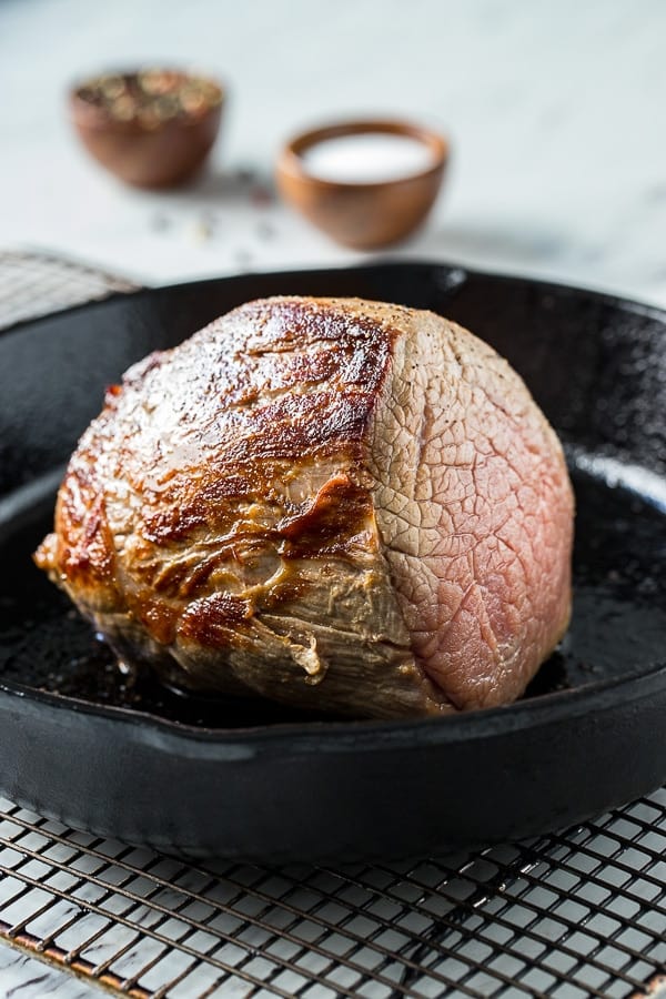 Seared eye of round roast in a skillet