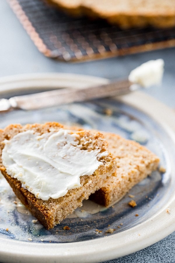 sliced irish brown bread with butter on a plate.