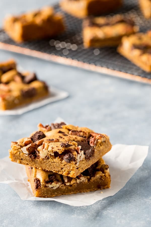 Mexican chocolate blonde brownies stacked on paper