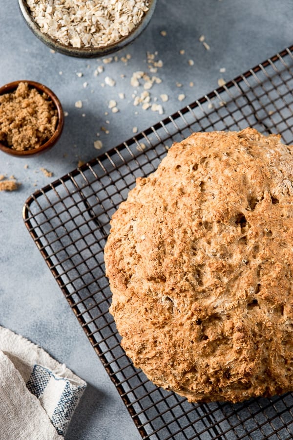 Loaf of irish brown bread on a cooling rack