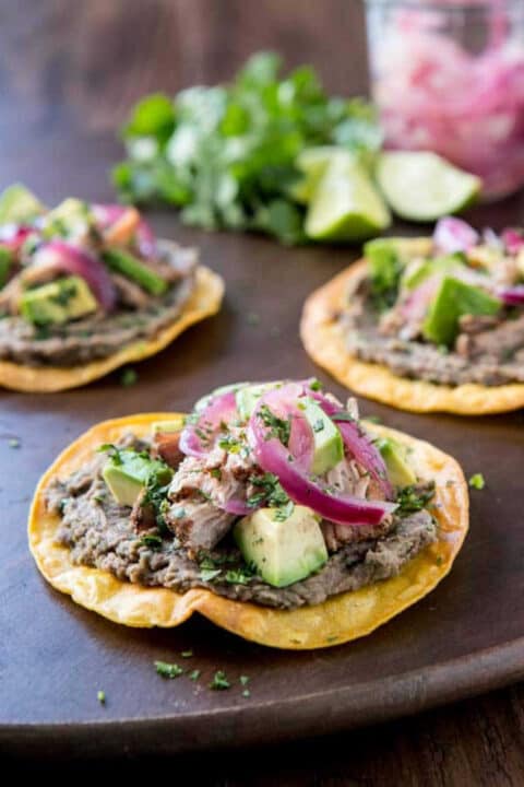 shredded pork tostadas on a platter.