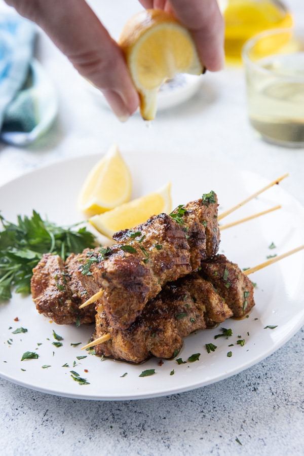 cooked ras el hanout grilled pork tenderloin skewers with a squeeze of lemon