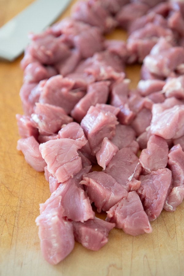 pork tenderloin pork chunks on a cutting board