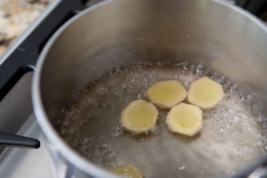 cooked ginger syrup in a pan on the stove for the gin and ginger ale cocktail. 