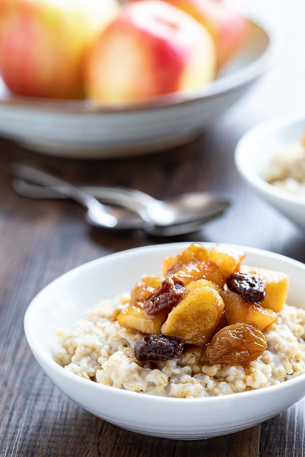 bowl of instant pot steel cut oats with apple compote in a bowl. 