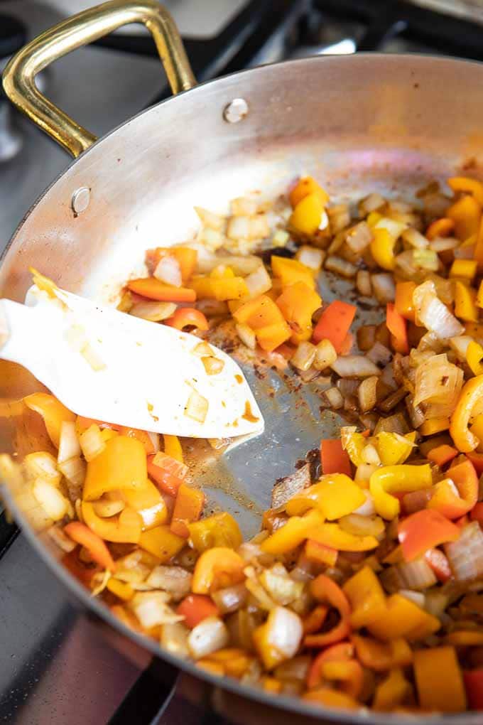 pan with onions and peppers for the barley risotto.