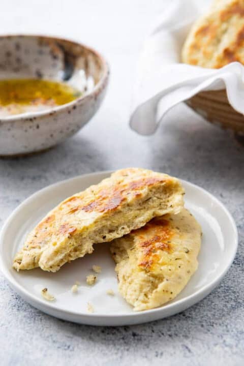 No yeast bread split in half on a plate.