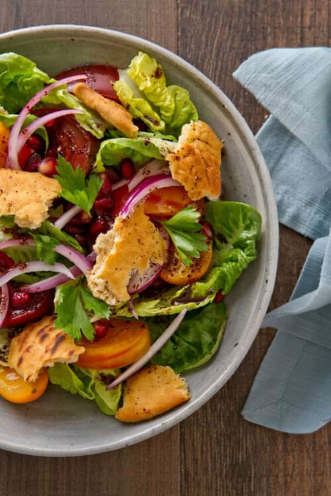 Overhead photo of Fattoush Salad Recipe in a bowl with a napkin.