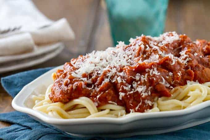 The BEST spaghetti meat sauce served over spaghetti on a platter.