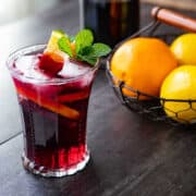 A red wine spritzer cocktail in a glass.
