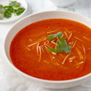 Bowl of Sopa de Fideo with cilantro garnish.