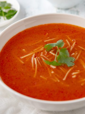 Bowl of Sopa de Fideo with cilantro garnish.